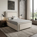Modern bedroom with a bed, nightstands, and artwork on the wall.