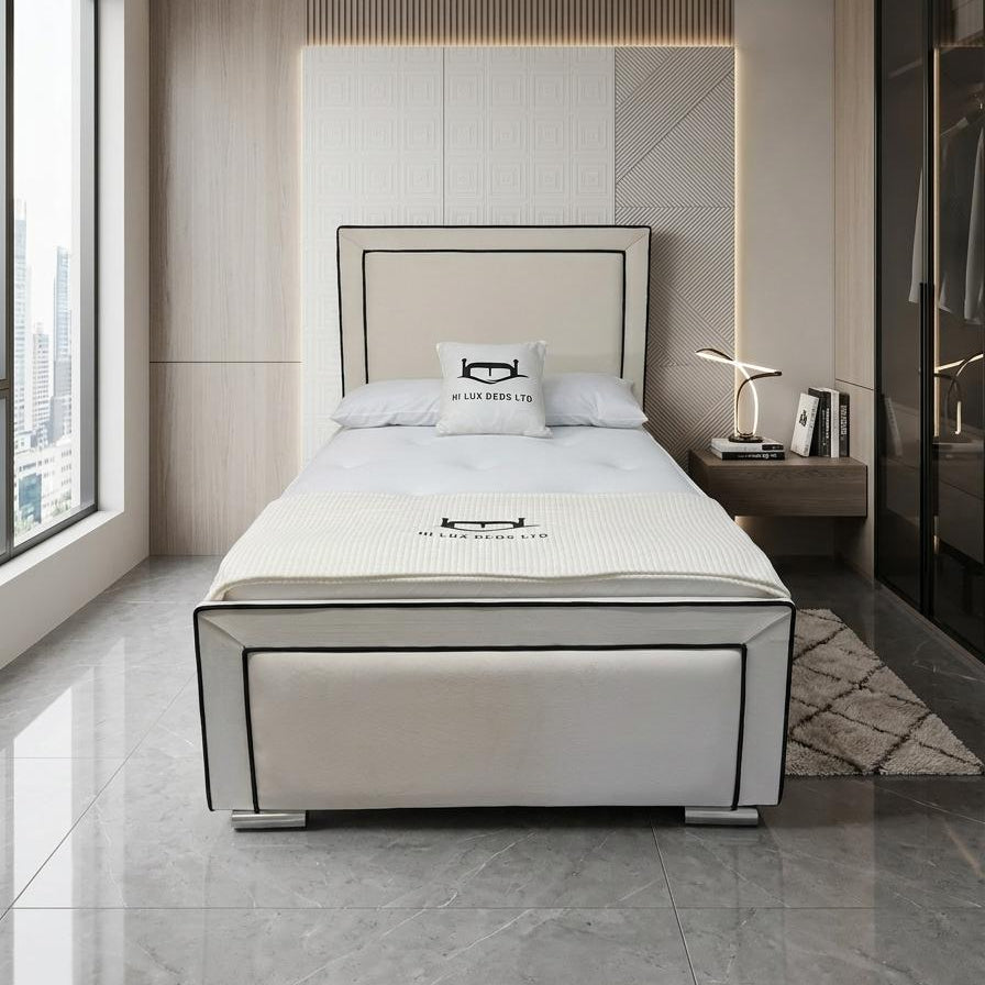 Modern bedroom with a bed, nightstands, and decorative elements.