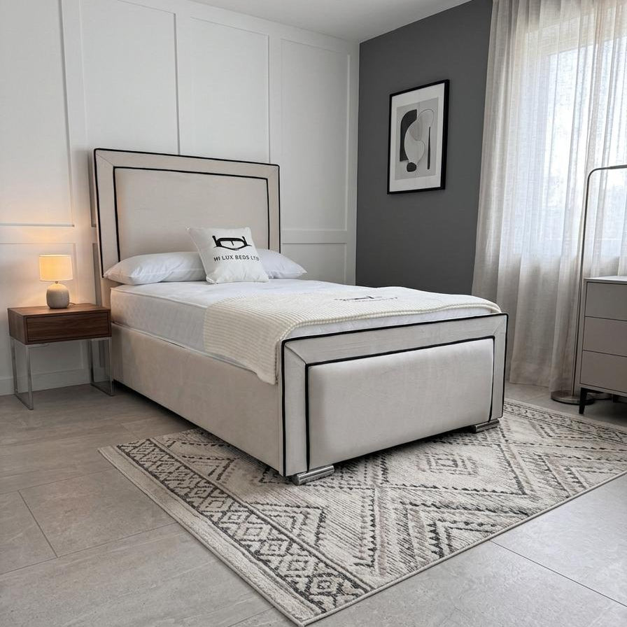 Modern bedroom with a bed, nightstands, and decor elements.