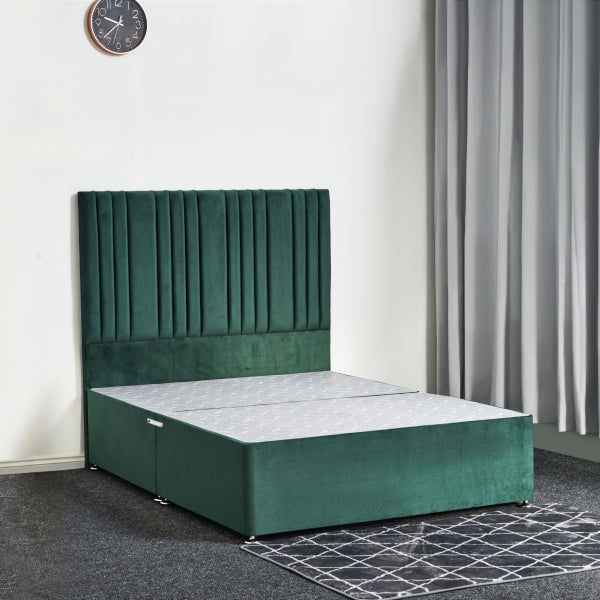 Green upholstered bed with a white mattress in a room with a clock and curtains.

Lilly Divan Bed detail - Elegant UK-made divan with drawer storage