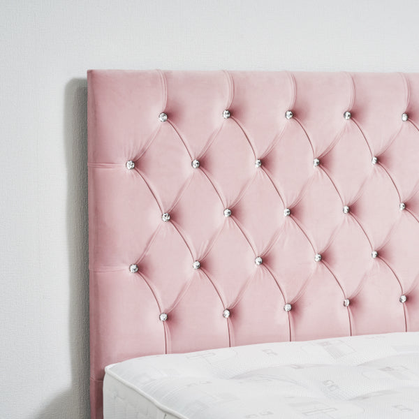 Pink tufted headboard with decorative buttons on a white wall.

Narjis Divan Bed detail - Premium fabric divan handcrafted in the UK