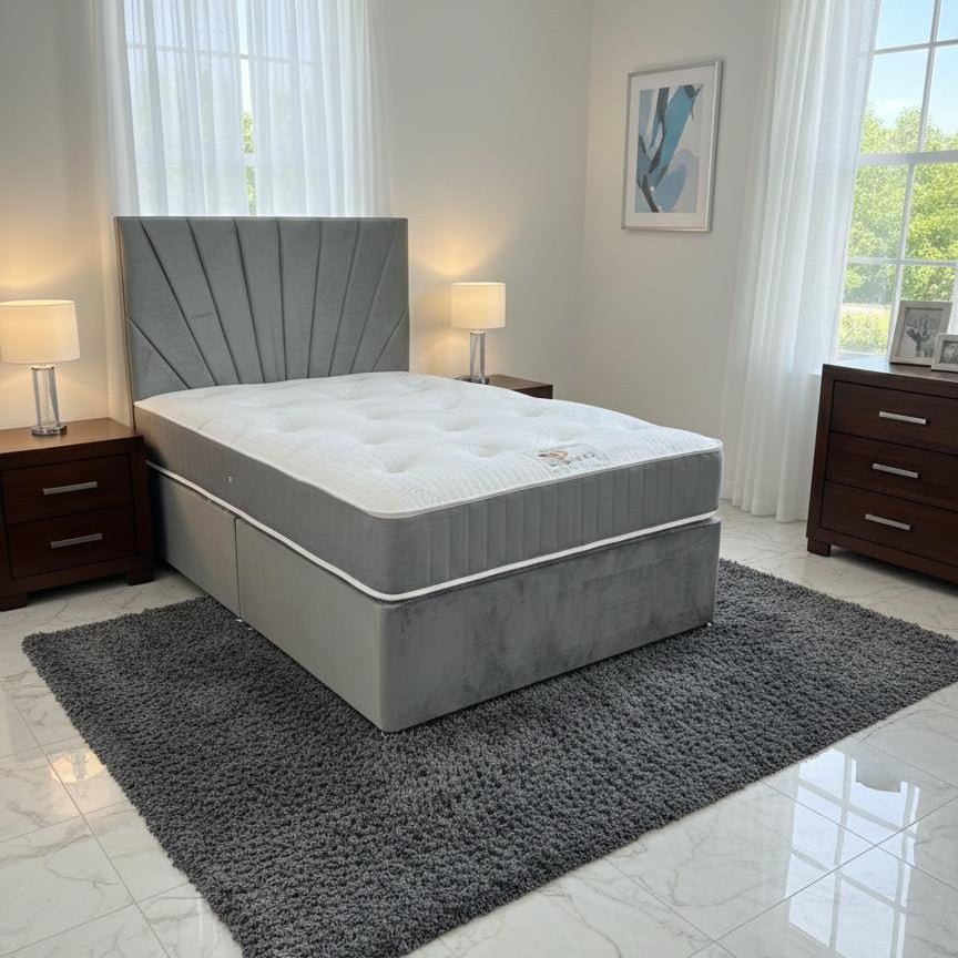 Gray bed with tufted headboard in a modern bedroom setting.