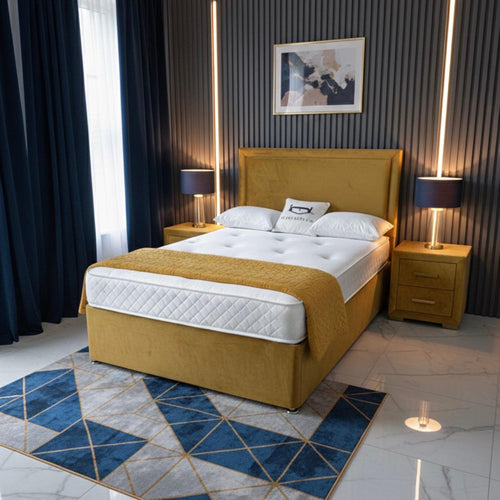 Modern bedroom with yellow bed, marble floor, and decorative rug.