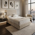 Modern bedroom with a large bed, side tables, and wall art.