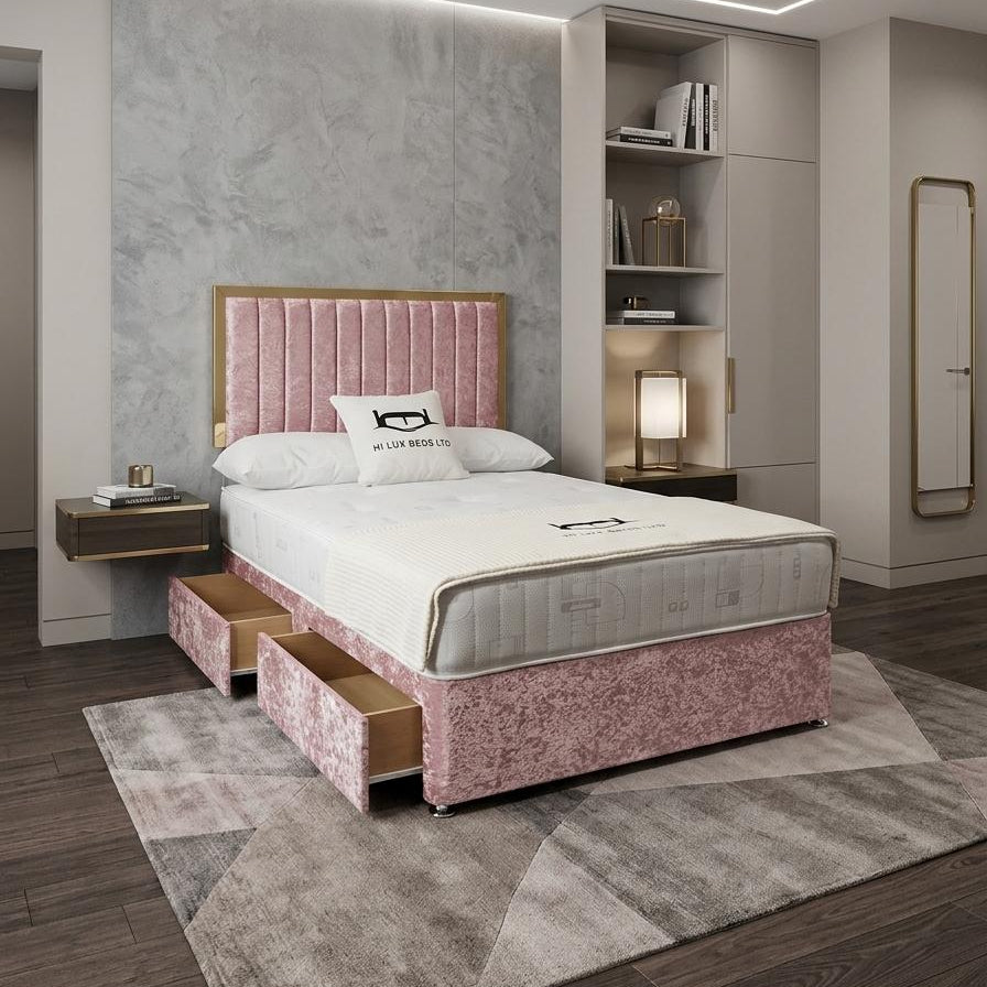 Modern bedroom with pink upholstered bed and built-in shelves.