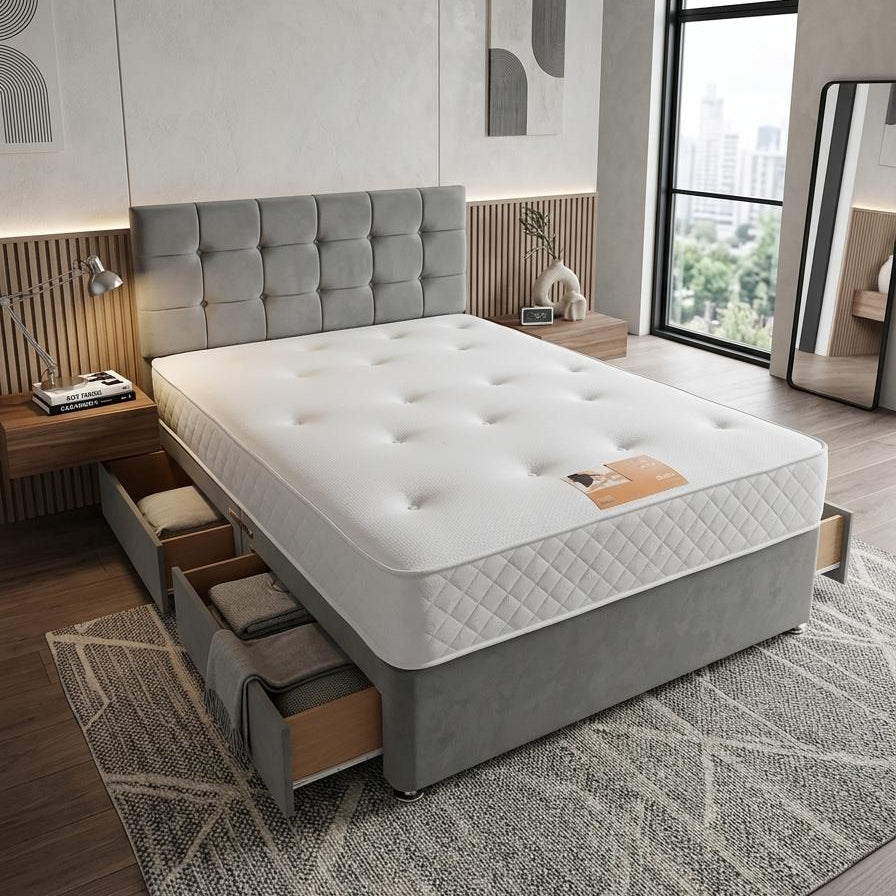 Modern bedroom with a gray upholstered bed and large windows.