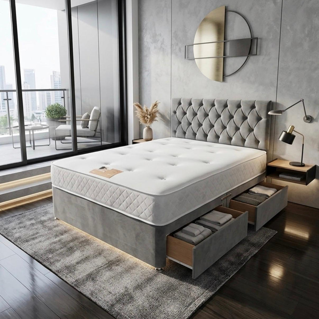 Modern bedroom with a gray upholstered bed and large windows.