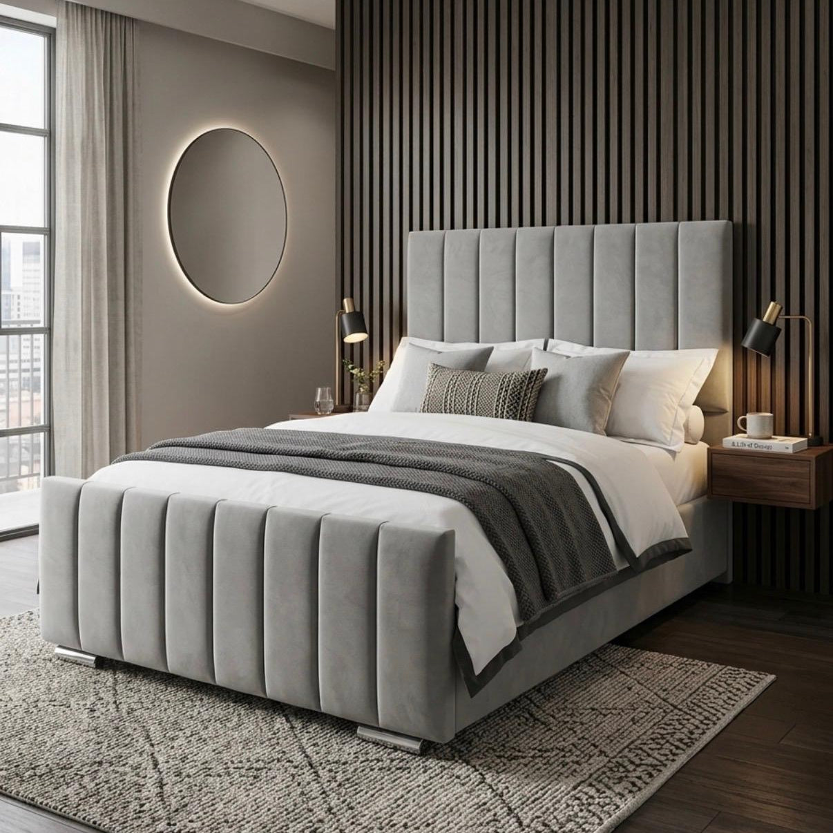 Modern bedroom with a gray upholstered bed and decorative wall lighting.