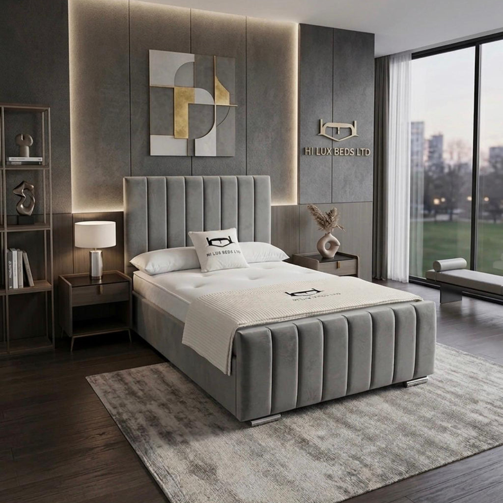 Modern bedroom with gray upholstered bed, nightstands, and wall art.
