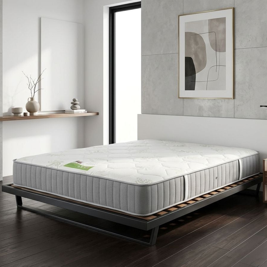 Mattress on a bed frame in a modern bedroom setting