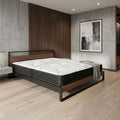 Modern bedroom with a bed and nightstands in a stylish room.