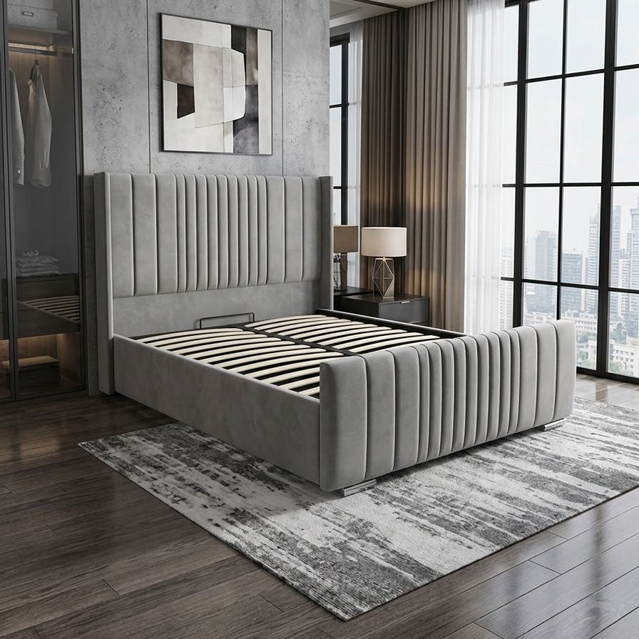 Modern bedroom with a gray upholstered bed, large windows, and a cityscape view.