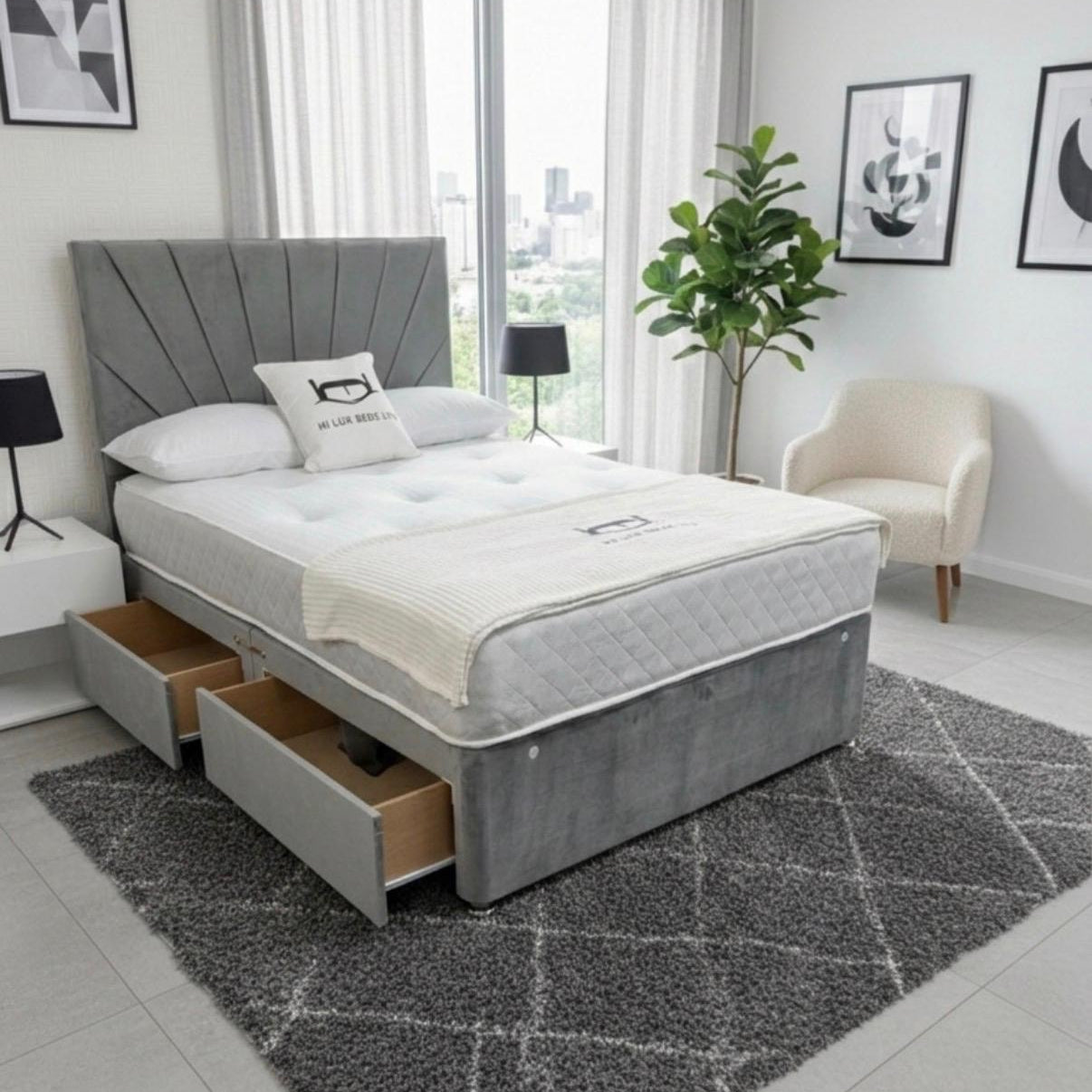 Gray upholstered bed with storage drawers in a modern bedroom setting.