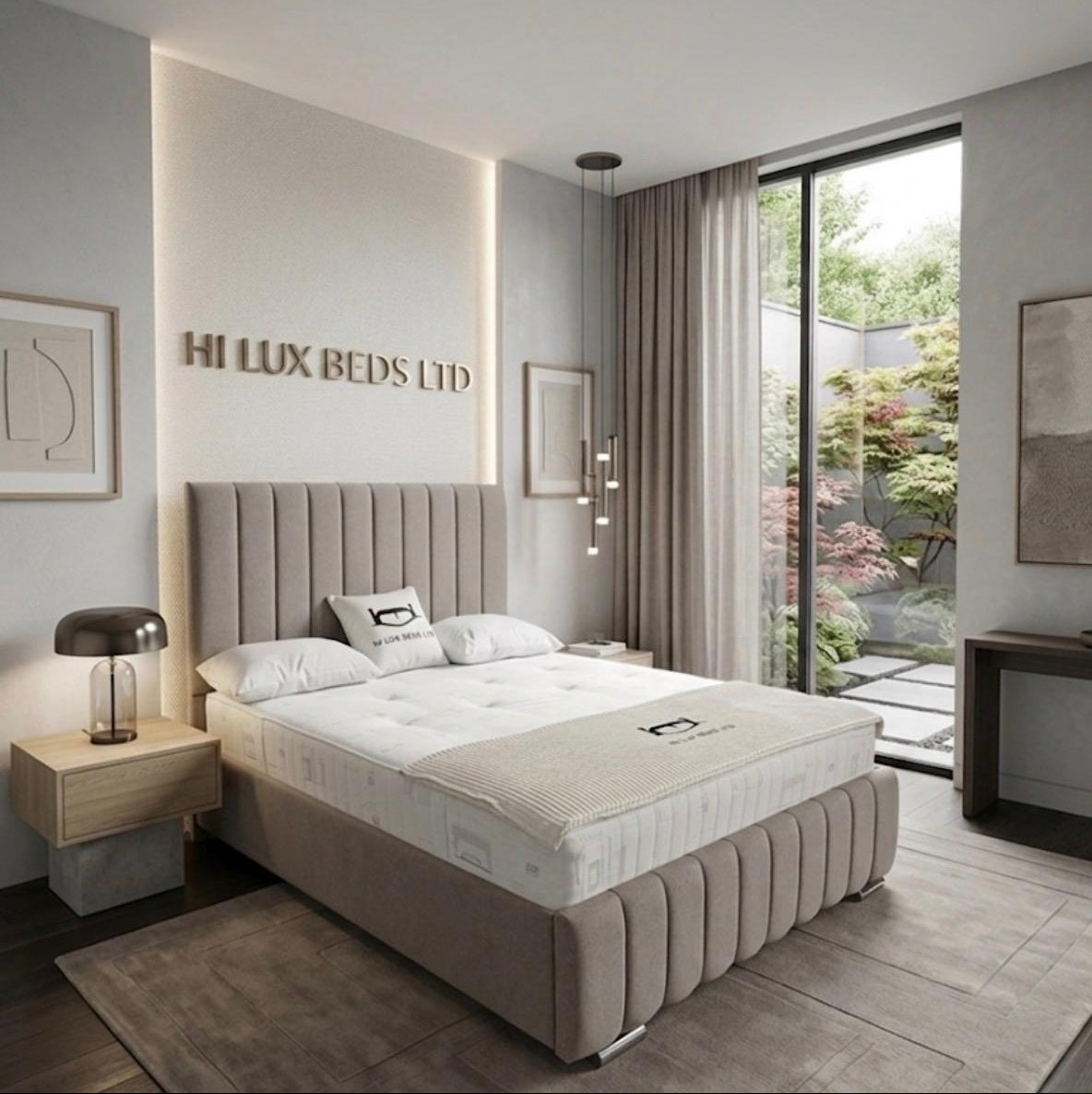 A modern upholstered bed in a styled bedroom setting, featuring a tufted beige headboard and matching bed frame, white bedding, and a view of a garden through a large window.